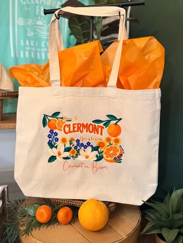 Clermont in Bloom tote bag with Welcome to Clermont artwork
